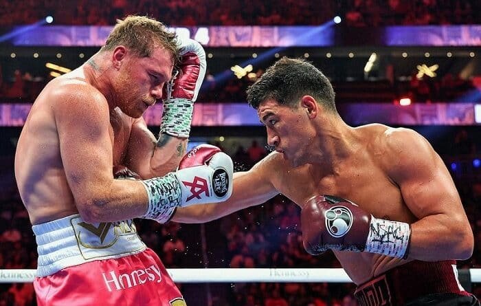 為什麼如日中天的 Canelo Álvarez 會敗給 Dmitry Bivol？本文從蘇聯式鐘擺步、距離控制的技術拆招，一路深度解析到 DAZN 與推廣公司的拳壇政治角力。別再拿 175 磅的體格劣勢當藉口，帶你看懂這場教科書級別的風格碾壓之戰！